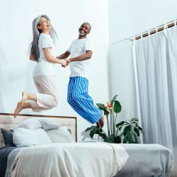 Cinematic image of an happy multiethnic senior couple.