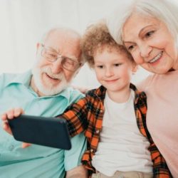 Grandparents and grandson playing at home